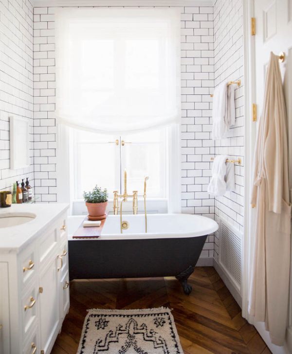 ali-cayne-nyc-townhouse-home-greenwich-village-bathroom-bath-tub-black-gold