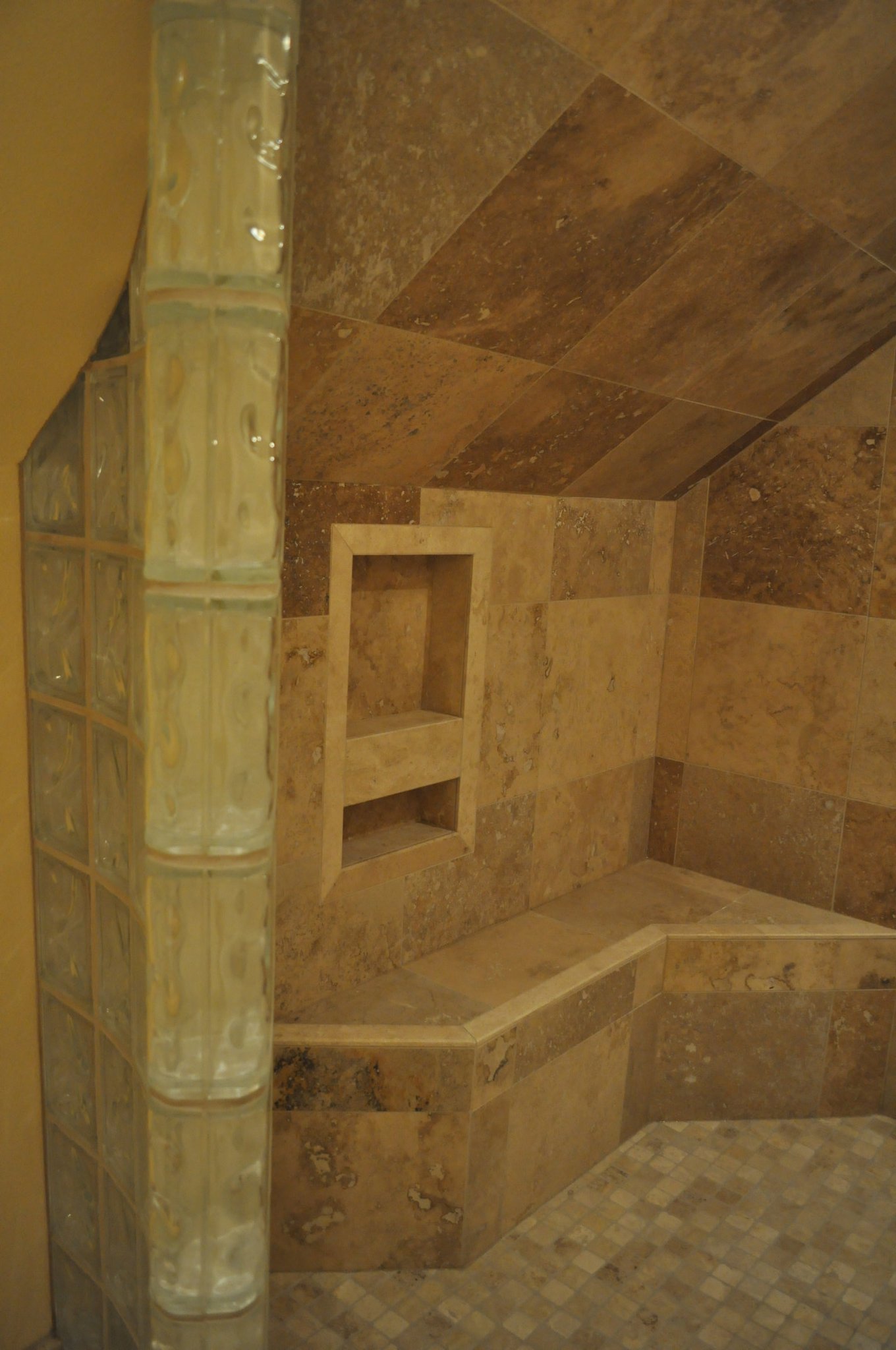 bathroom-niche-travertine-heated-bench-glass-block-wall-quality-remodeling-specialists-Jake-Ruiz-jpg