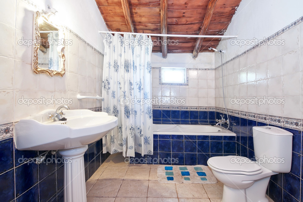 Vintage retro bathroom. Blue tiles.