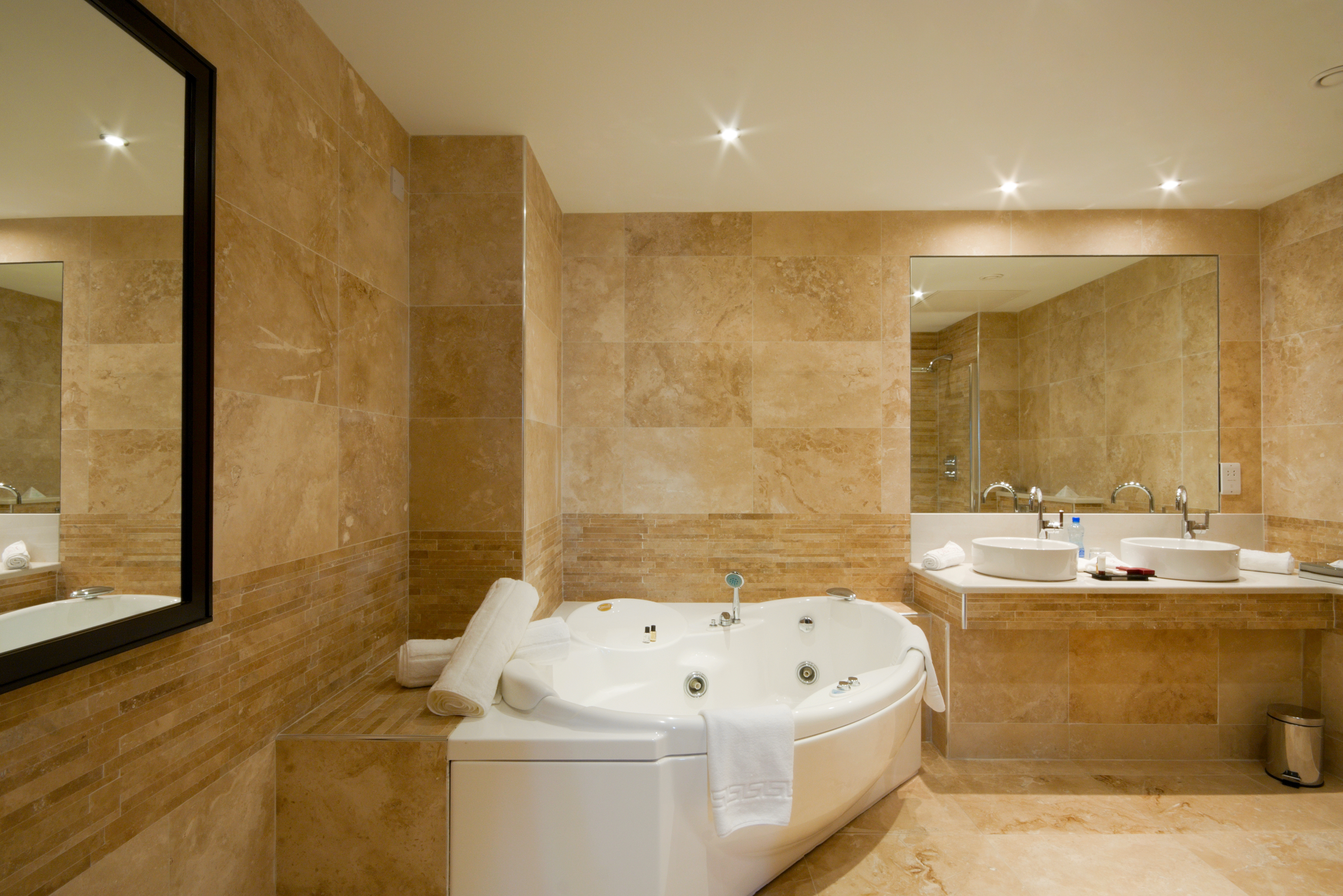 Modern Bathroom interior with marble tiles and mirror