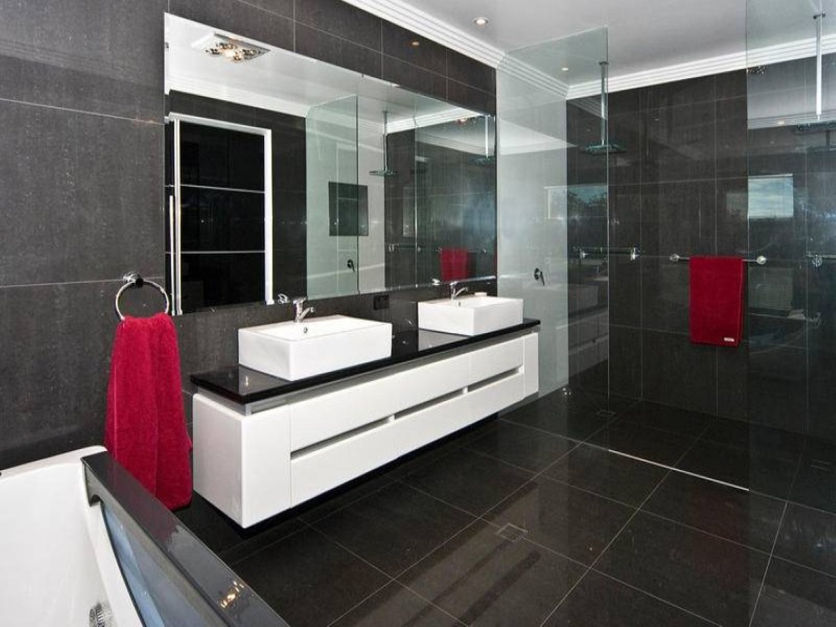 cool-brown-bathroom-tile-idea-with-awesome-white-vanity-set-between-glass-room-divider-also-ring-stainless-steel-towel-shelf