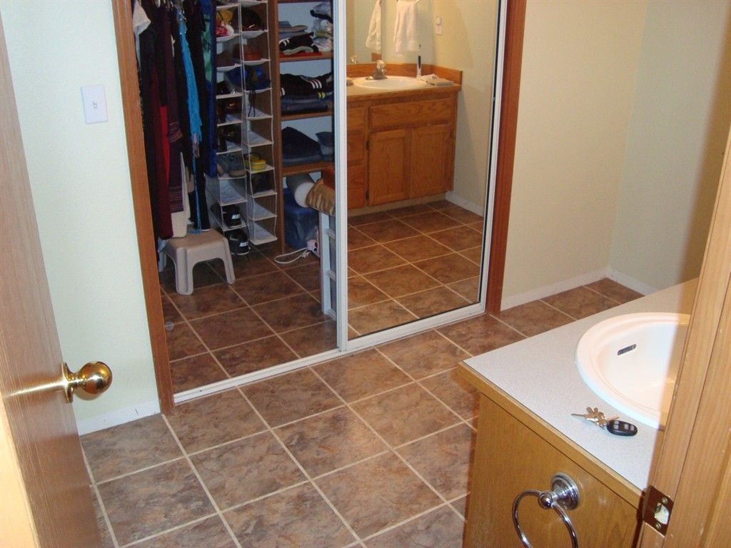 floor-design-fetching-bathroom-decoration-with-light-brown-wood-bathroom-vanity-and-brown-self-sticking-vinyl-floor-tiles-astonishing-flooring-design-using-self-sticking-vinyl-floor-tiles
