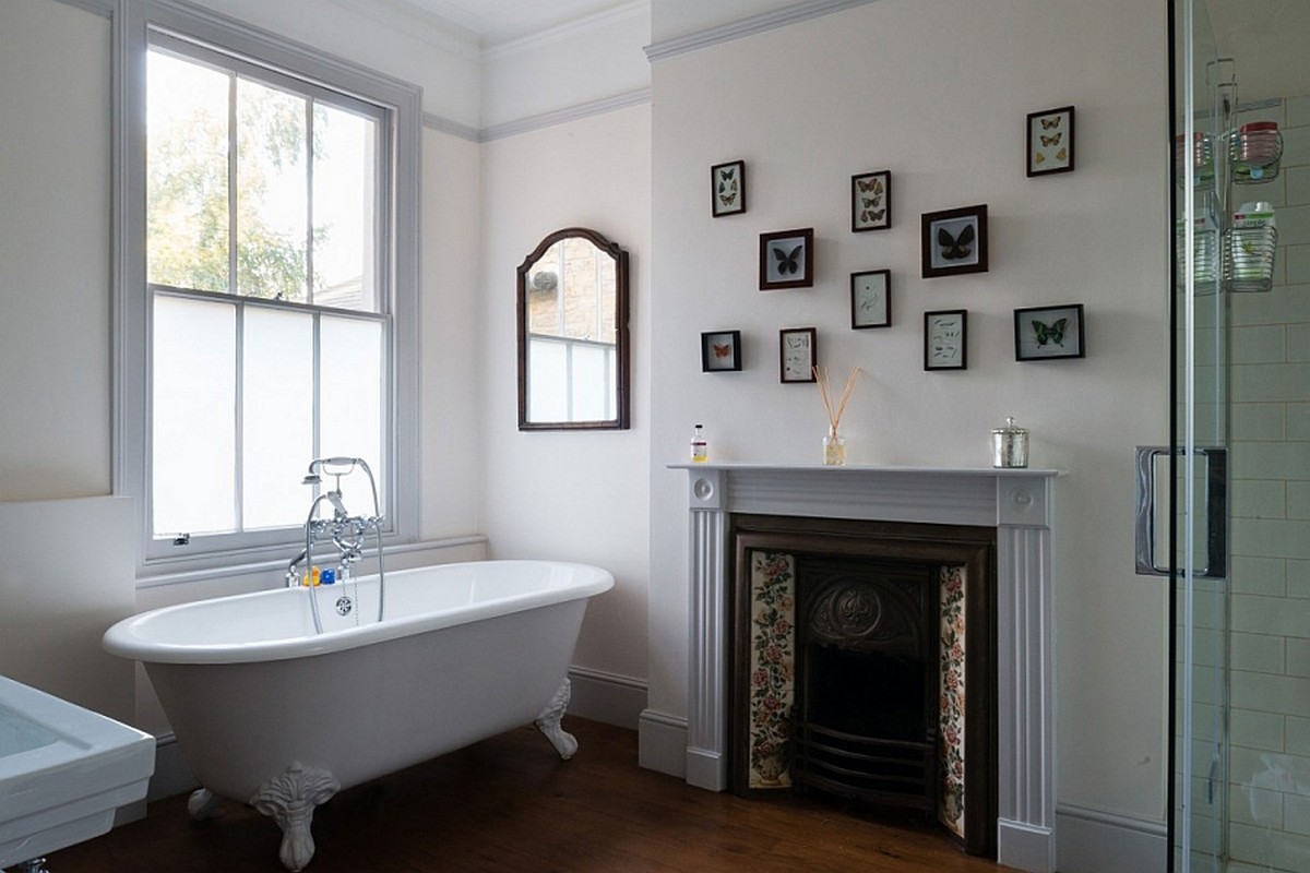 antique-fireplace-mantel-idea-feat-beautiful-clawfoot-bathtub-design-and-wooden-bathroom-floor-tile