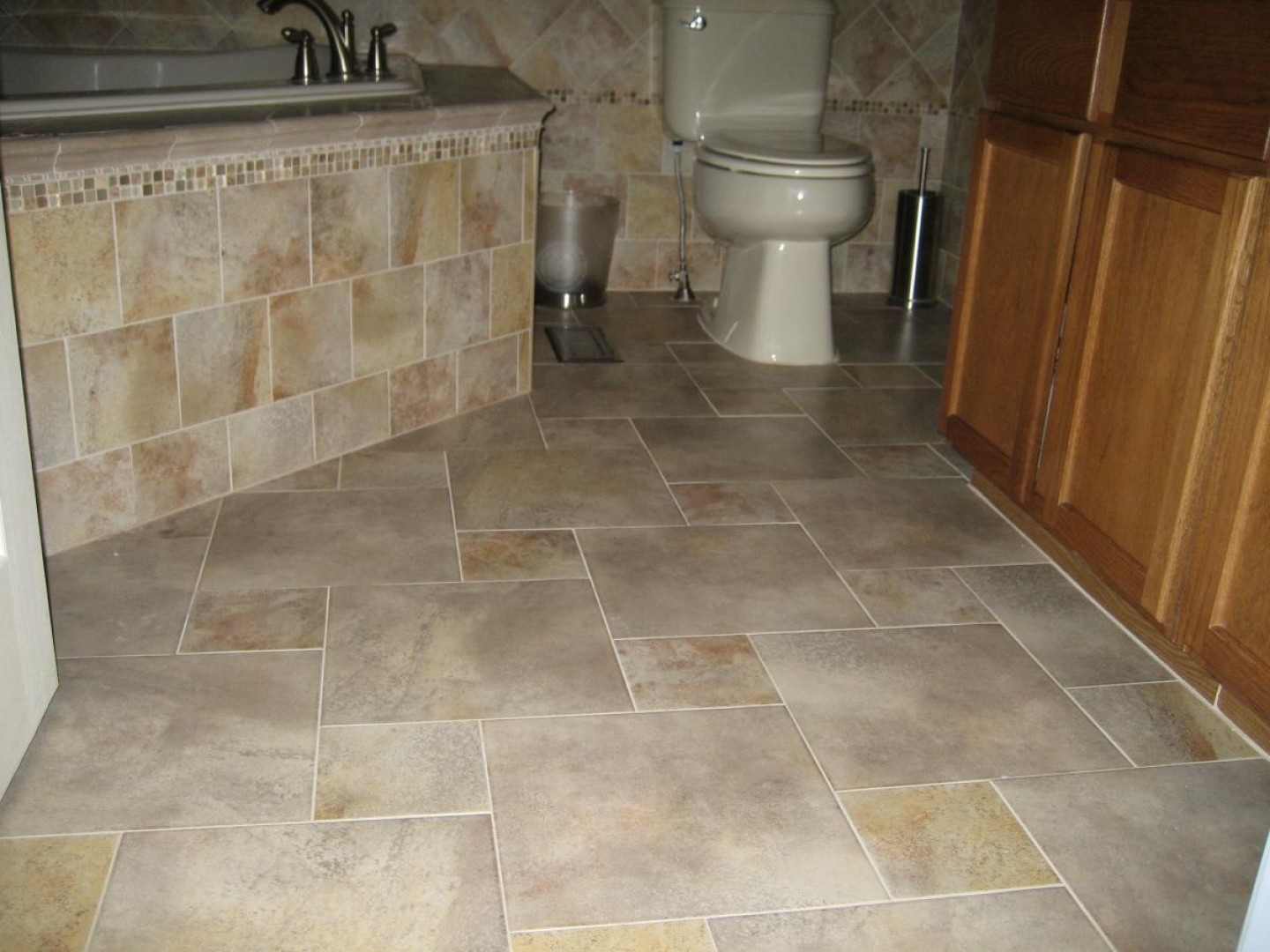 bathroom-beautiful-bathroom-vintage-tile-floor-pattern-with-light-brown-marble-tile-floor-and-wall-layout-and-white-tub-on-the-corner-also-white-toilet-and-wooden-cabinet-as-well-as-tile-install