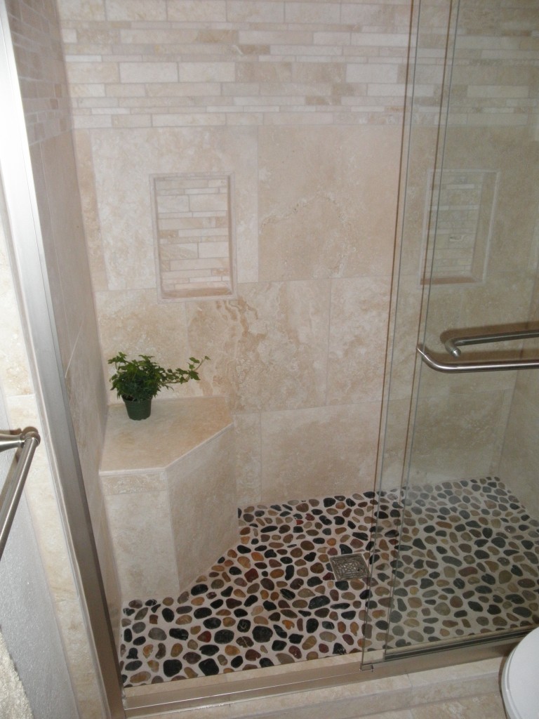 bathroom-fancy-black-and-white-shower-pebble-floor-with-cornered-small-stone-bench-also-natural-marble-walls-and-sliding-glass-shower-closer-fancy-pebble-tile-bathroom-ideas