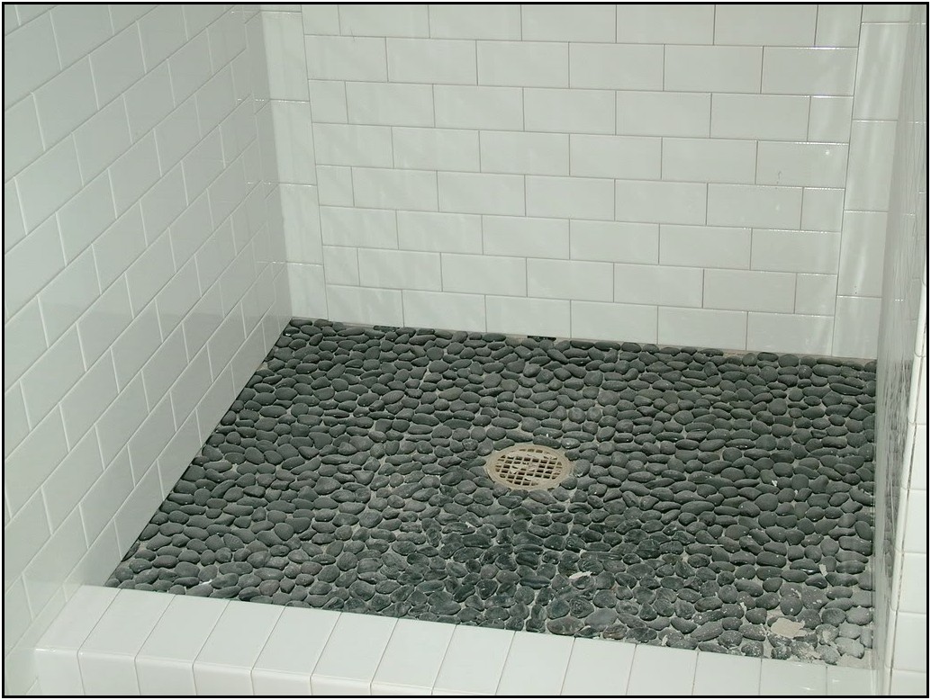 minimalist-bathroom-dark-grey-mini-stone-pebble-shower-floor-circular-stainless-steel-shower-drain-sleek-white-rectangular-tile-ceramic-bathroom-wall-white-rectangular-tile-ceramic