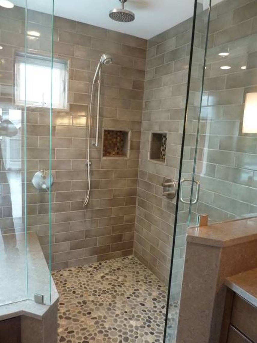 walk-in-shower-with-ceramic-walls-and-pebble-floor-tiles