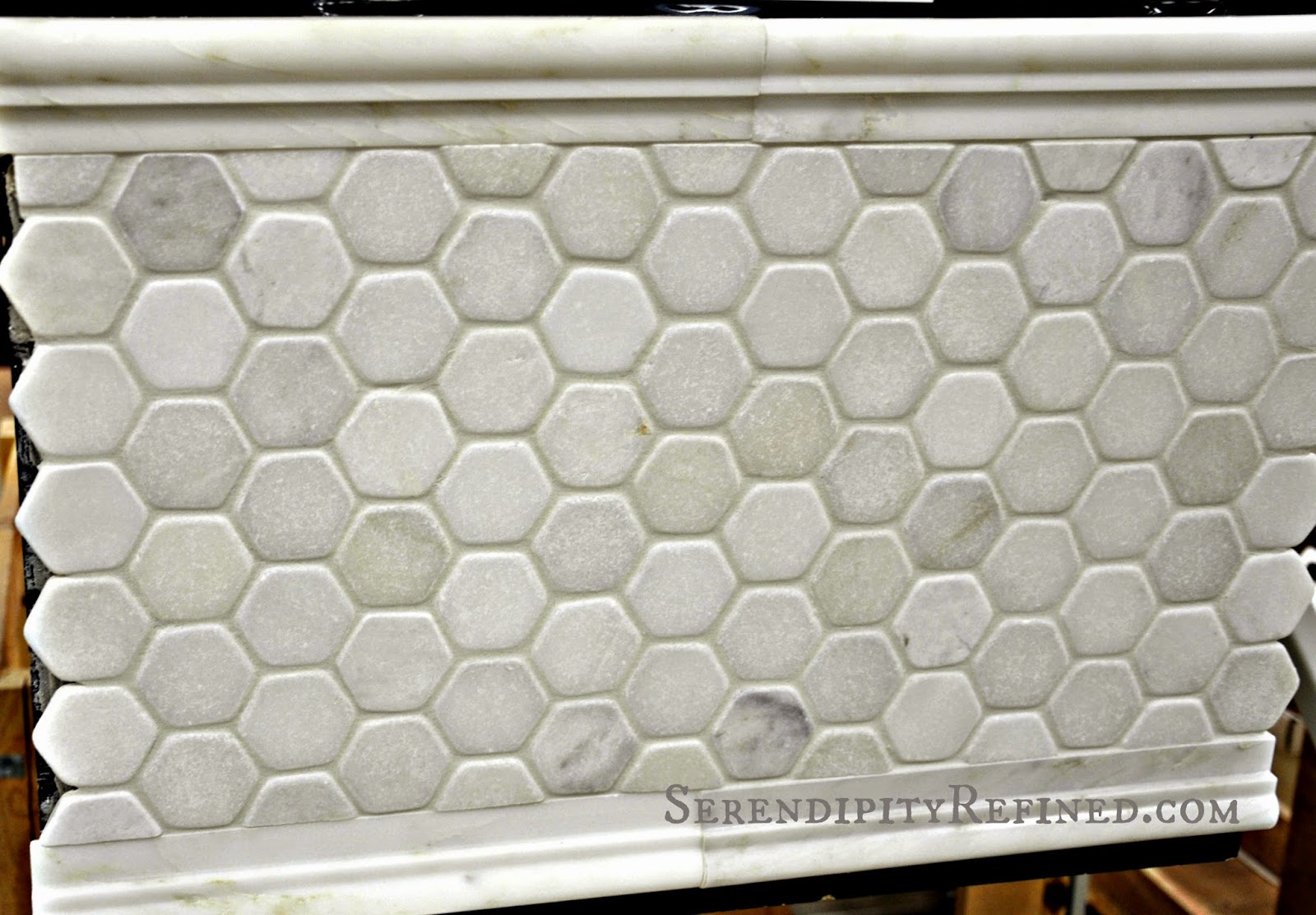 Honed hexagonal marble floor tile and marble molding