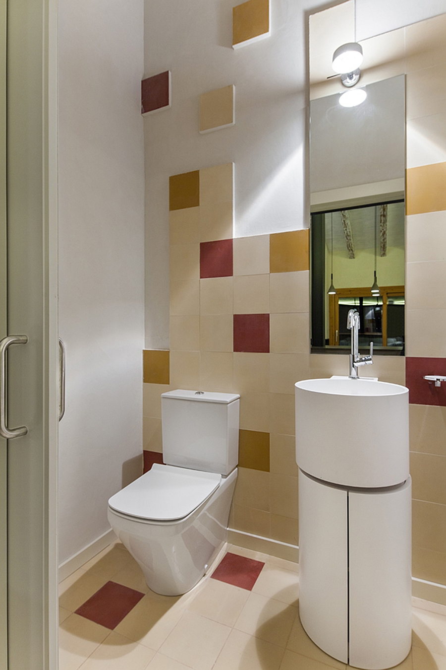 Small-bathroom-with-fun-use-of-red-and-yellow-tiles