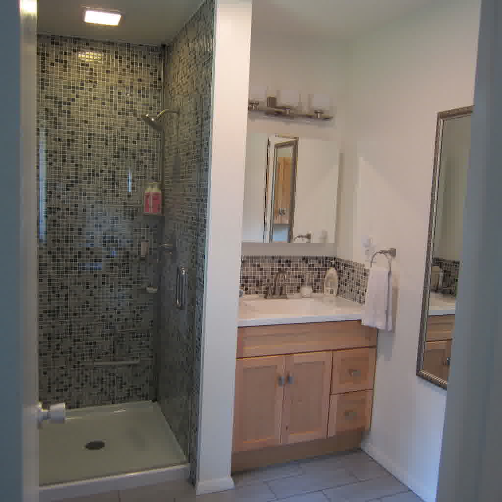 bathroom-bathroom-design-idea-with-shower-stall-designed-with-grey-mosaic-tile-wall-and-white-shower-pan-also-glass-door-and-chic-wall-lighting-combine-with-brown-wooden-kitchen-cabinet-designed-with