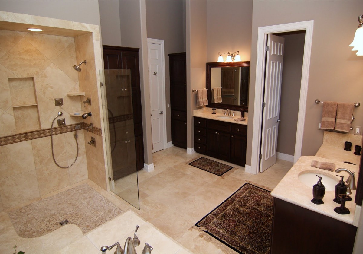 bathroom-stylish-shared-bathroom-design-with-curve-pebbles-pan-shower-and-glass-partition-two-separated-wooden-sink-with-stone-marble-countertops-also-decorative-square-rugs-over-the-traventine-tiles