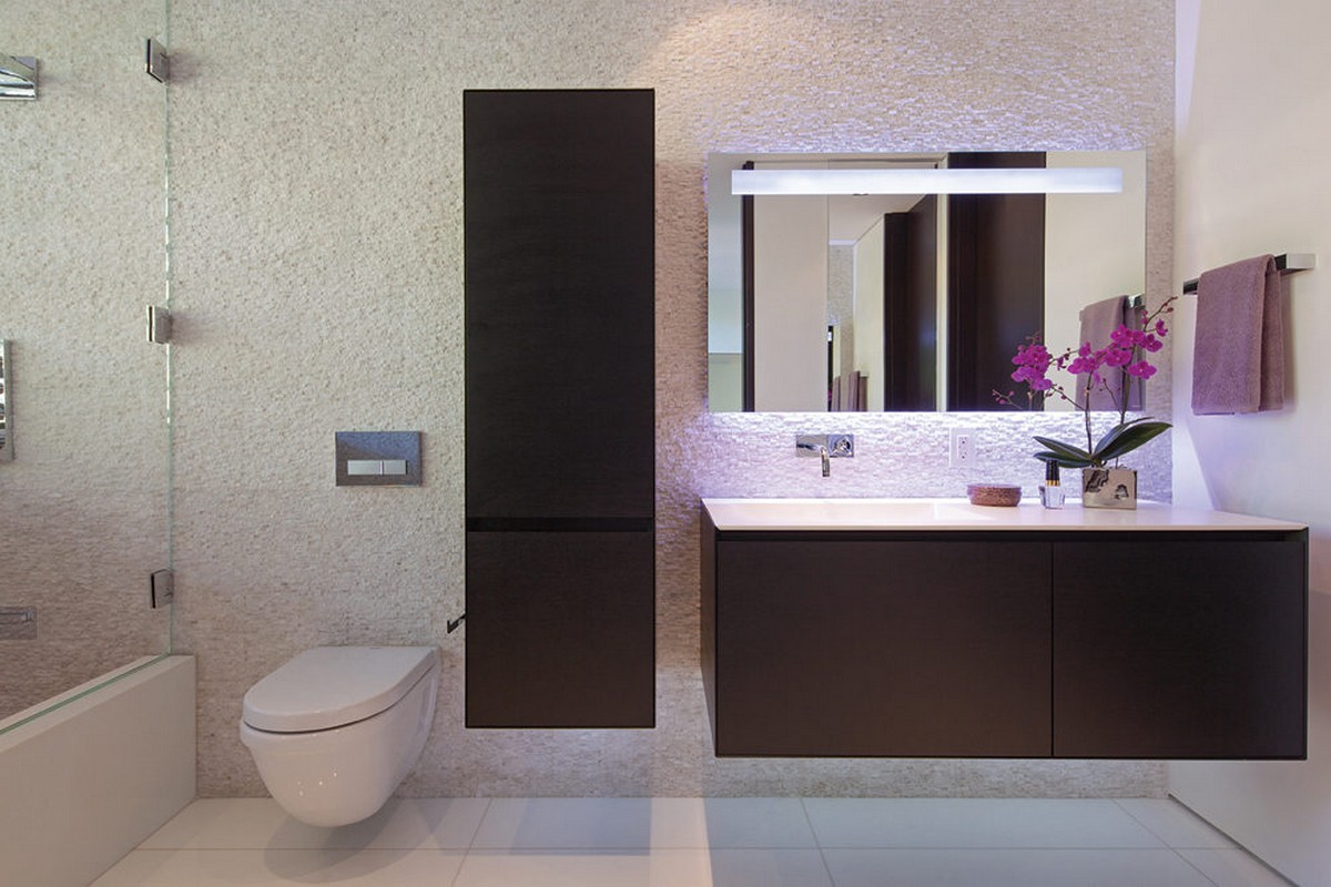 luxury-bathroom-design-with-white-wall-hung-toilet-and-modern-vanity-cabinets-also-textured-wall-and-white-ceramic-tile-floor