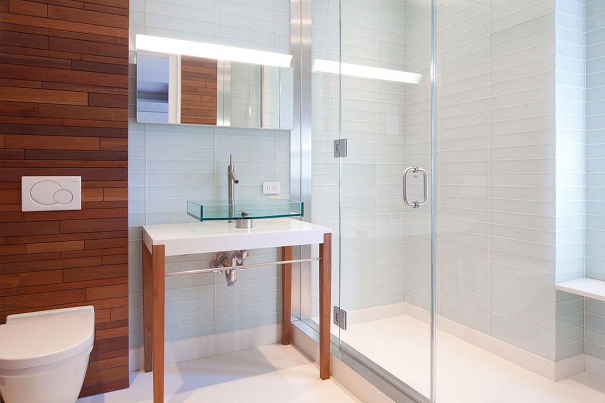 modern-luxury-bathroom-with-white-wall-hung-toilets-and-glass-sink-white-vanity-wooden-stands-also-glass-shower-stalls-and-brown-tile-design-ideas