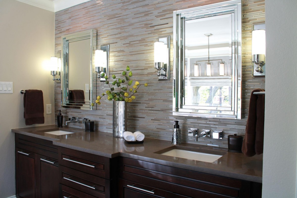 natural-stone-bathroom-wall-tile-mirror-with-glasses-frame-dark-brown-real-wood-vanity-with-storage-drawers-mounted-washbasin-bathroom-sconces-lighting-fixtures-1200x800