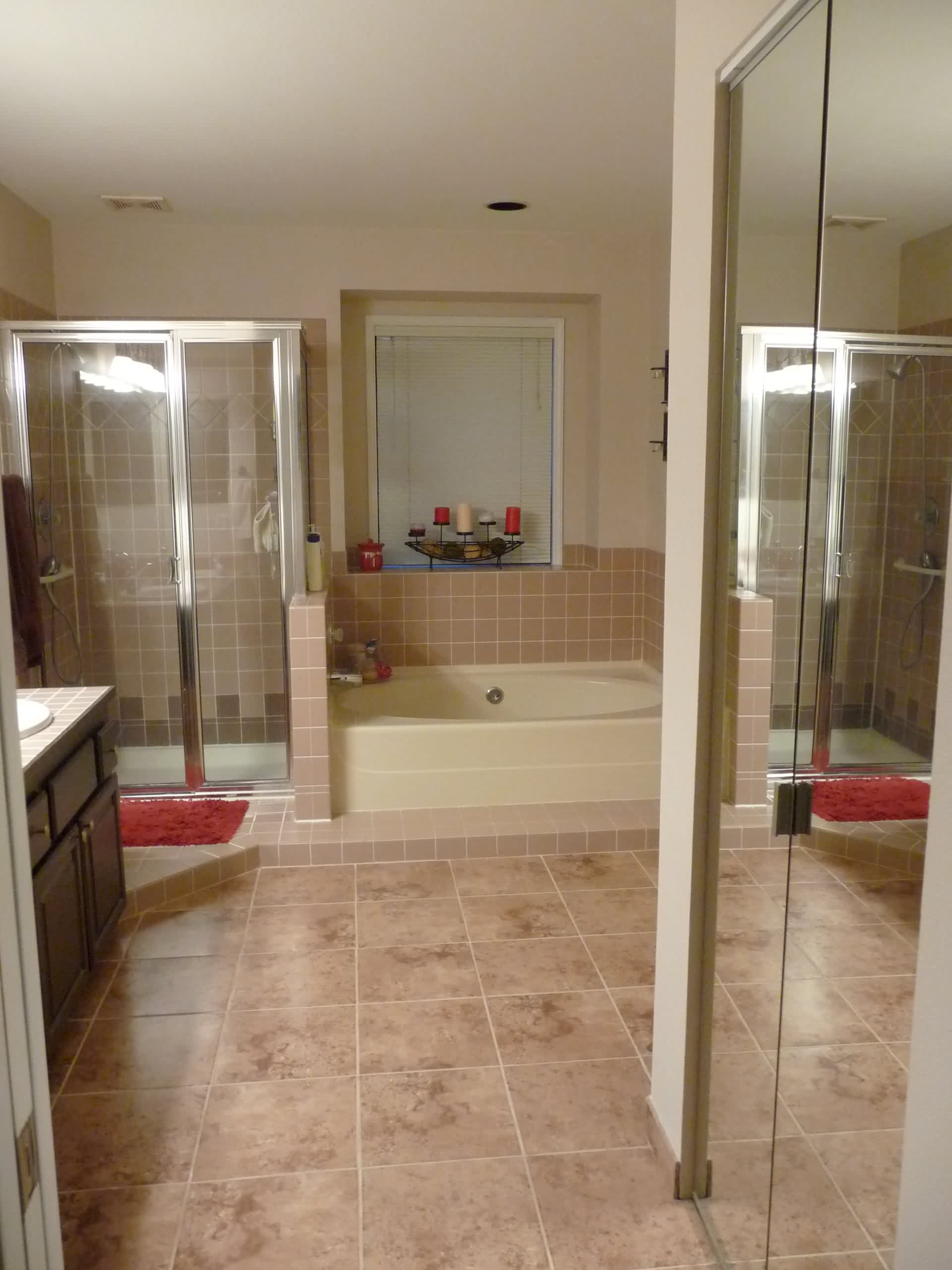 interior-soft-brown-bathroom-tile-floor-connected-by-cream-bathtub-next-to-glass-shower-stalls-elegant-brown-bathroom-tiles-offers-pleasing-nuance-for-your-bathroom